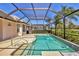 Screened in pool area, featuring a spa, with patio at 6547 Oakland Hills Dr, Lakewood Ranch, FL 34202