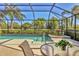 An inviting in-ground pool with screened enclosure and relaxing views at 6547 Oakland Hills Dr, Lakewood Ranch, FL 34202