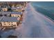 Coastal condos situated on a white sandy beach with clear ocean waters at 6700 Gulf Dr # B8, Holmes Beach, FL 34217