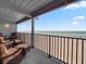 Spacious covered balcony providing beautiful ocean views and comfortable seating at 6700 Gulf Dr # B8, Holmes Beach, FL 34217