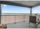 Relax on the balcony with ocean views and seating available at 6700 Gulf Dr # B8, Holmes Beach, FL 34217