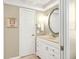 Bathroom with vanity, sink, and framed mirror offers a bright and clean aesthetic at 6700 Gulf Dr # B8, Holmes Beach, FL 34217