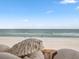 Scenic beach view featuring white sand, turquoise water, and clear sky for relaxation and ocean adventures at 6700 Gulf Dr # B8, Holmes Beach, FL 34217