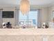 Dining room with elegant chandelier and balcony with beach views at 6700 Gulf Dr # B8, Holmes Beach, FL 34217