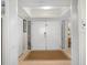 Bright entryway with double doors, tile flooring, and decorative trim, offering a welcoming entrance to the home at 6700 Gulf Dr # B8, Holmes Beach, FL 34217