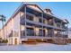 Coastal home featuring multiple levels of balconies overlooking the beach, showcasing beautiful architectural design and beachside living at 6700 Gulf Dr # B8, Holmes Beach, FL 34217