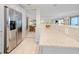 Modern kitchen with stainless steel appliances, light countertops, and neutral color palette at 6700 Gulf Dr # B8, Holmes Beach, FL 34217
