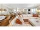 Spacious living room featuring comfortable seating, coastal decor, and lots of natural light for a bright and airy ambiance at 6700 Gulf Dr # B8, Holmes Beach, FL 34217