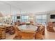 Bright living area featuring coastal-inspired decor, large mirrors, and comfortable seating at 6700 Gulf Dr # B8, Holmes Beach, FL 34217