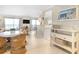 Open-concept living room with stylish décor, natural light, and cozy wicker furniture at 6700 Gulf Dr # B8, Holmes Beach, FL 34217