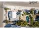 Aerial shot showcasing a private backyard pool surrounded by lush landscaping at 701 N Bay Blvd, Anna Maria, FL 34216
