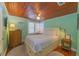 Cozy bedroom with ample natural light, ceiling fan, and soft decor at 701 N Bay Blvd, Anna Maria, FL 34216