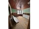 Renovation stage bedroom with original wood ceiling and ample light at 701 N Bay Blvd, Anna Maria, FL 34216