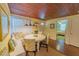 Cozy dining area with natural light and a unique built-in seating at 701 N Bay Blvd, Anna Maria, FL 34216