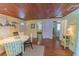 Charming dining room with wood floors, ceiling, and bright decor at 701 N Bay Blvd, Anna Maria, FL 34216