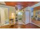 Interior view showing the bathroom, kitchen and living room in the home at 701 N Bay Blvd, Anna Maria, FL 34216