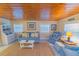Bright living room with matching sofas and nautical decor at 701 N Bay Blvd, Anna Maria, FL 34216