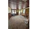 Empty living room with wood floors being renovated at 701 N Bay Blvd, Anna Maria, FL 34216