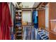 Organized closet featuring wooden shelving, hanging rods, and ample storage for clothing and accessories at 7017 Lennox Pl, University Park, FL 34201
