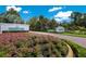 Community entrance with lush landscaping and signage at 7017 Lennox Pl, University Park, FL 34201