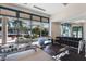 Bright gym with rowing machine, free weights, and scenic views through large windows at 7017 Lennox Pl, University Park, FL 34201