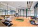 Yoga studio with mats, mirror, and fitness equipment for a complete workout experience at 7017 Lennox Pl, University Park, FL 34201