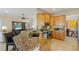An inviting kitchen featuring a granite countertop island and stainless steel appliances at 7017 Lennox Pl, University Park, FL 34201