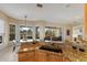An open kitchen concept with granite countertops and backyard patio view at 7017 Lennox Pl, University Park, FL 34201