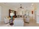 Bright living room with a neutral color palette, comfortable seating, and a welcoming atmosphere at 7017 Lennox Pl, University Park, FL 34201