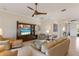Inviting living room with stylish furnishings, entertainment center, and a bright, open layout at 7017 Lennox Pl, University Park, FL 34201