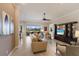 Bright living room features large windows, comfortable seating, and scenic views of the water at 7017 Lennox Pl, University Park, FL 34201