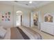 A main bedroom features a queen size bed, ensuite bathroom and walk-in closet at 7017 Lennox Pl, University Park, FL 34201