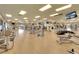 Well-equipped gym with cardio machines, weightlifting stations, and mirrored walls at 8403 Grand Estuary Trl # 103, Bradenton, FL 34212
