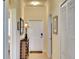 Inviting hallway with neutral tones, tiled floor, and tasteful decor at 8403 Grand Estuary Trl # 103, Bradenton, FL 34212