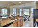 Granite countertops, stainless steel appliances, and a cozy breakfast nook at 8403 Grand Estuary Trl # 103, Bradenton, FL 34212