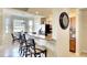 Kitchen breakfast bar with granite countertop and stainless appliances at 8403 Grand Estuary Trl # 103, Bradenton, FL 34212