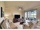 Bright living room with comfortable seating and picturesque outdoor views at 8403 Grand Estuary Trl # 103, Bradenton, FL 34212