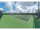 Exterior image shows well-maintained tennis courts with lush landscaping at 8403 Grand Estuary Trl # 103, Bradenton, FL 34212