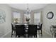 Bright dining area featuring tile floors, modern lighting and a large window at 9032 Excelsior Loop, Venice, FL 34293