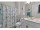 Clean bathroom with white vanity, shower, and neutral tones at 9127 Barrier Coast Trl, Parrish, FL 34219