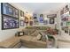 Entertainment room features a large sectional sofa and walls adorned with sports memorabilia at 10002 Cherry Hills Avenue Cir, Bradenton, FL 34202