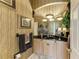 Charming powder room with unique wallpaper, granite countertop, and decorative mirror at 10002 Cherry Hills Avenue Cir, Bradenton, FL 34202