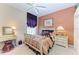 Charming bedroom with decorative bed frame, window seat, and matching vanity at 10002 Cherry Hills Avenue Cir, Bradenton, FL 34202