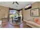 Dining area with breakfast table, chandelier, hardwood floors and tv at 10002 Cherry Hills Avenue Cir, Bradenton, FL 34202