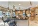 Open kitchen with a center island, stainless appliances, and custom cabinetry at 10002 Cherry Hills Avenue Cir, Bradenton, FL 34202