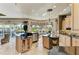 Large kitchen with island, modern appliances, and natural light offering scenic backyard views at 10002 Cherry Hills Avenue Cir, Bradenton, FL 34202