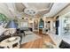 Comfortable living room with hardwood floors, custom ceilings, and ample space at 10002 Cherry Hills Avenue Cir, Bradenton, FL 34202