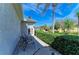 Outdoor patio with lounge seating and well-maintained landscaping at 10002 Cherry Hills Avenue Cir, Bradenton, FL 34202