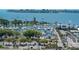 Expansive aerial view of a marina with numerous yachts, surrounded by lush greenery and cityscape at 101 S Gulfstream Ave # 4J, Sarasota, FL 34236