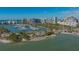 An aerial view of the property that is near the bay and marina, with a beach and waterfront at 101 S Gulfstream Ave # 4J, Sarasota, FL 34236